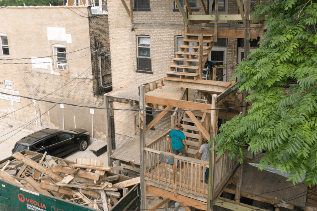 Demolition Crew tearing down deck