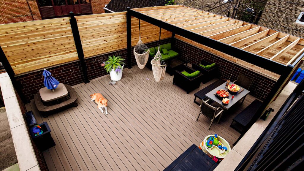 Cozy rooftop deck with modern furniture, privacy screens, and a lounging dog. (roof deck ideas )